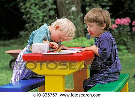 Two 2 year old boys painting View Large Photo Image Stock Photo - Two 2 year old boys painting. Fotosearch