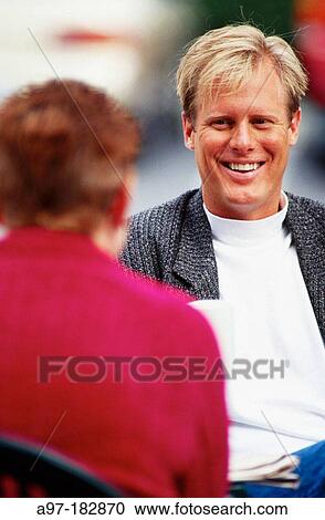 Two adults having a conversation View Large Photo Image Stock Image - Two adults having a conversation. Fotosearch