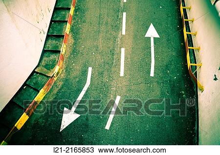 Two arrows on asphalt. View Large Photo Image Stock Image - Two arrows on asphalt.. Fotosearch
