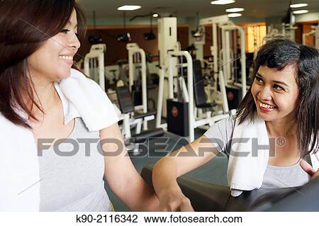 Two asian women at a treatmill, Jakarta, Indonesia, Southeast Asia. View Large Photo Image Stock Image - Two asian women at a treatmill, Jakarta, Indonesia, Southeast Asia.. Fotosearch