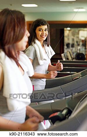 Two asian women on a treatmill, Jakarta, Indonesia, Southeast Asia. View Large Photo Image Stock Image - Two asian women on a treatmill, Jakarta, Indonesia, Southeast Asia.. Fotosearch