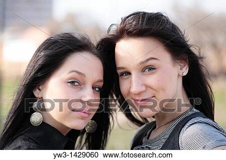 two beautiful brunette outdoor portrait View Large Photo Image Stock Image - two beautiful brunette outdoor portrait. Fotosearch
