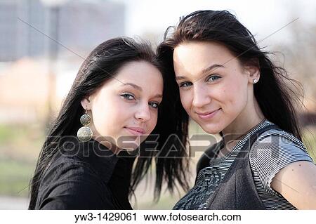 two beautiful brunette outdoor portrait View Large Photo Image Stock Image - two beautiful brunette outdoor portrait. Fotosearch