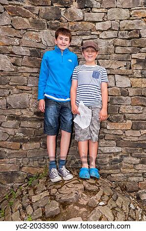 Two boys 13 and 9 at The Forbidden Corner in Middleham, Leyburn, North Yorkshire, England, Britain, Uk. View Large Photo Image Stock Image - Two boys 13 and 9 at The Forbidden Corner in Middleham, Leyburn, North Yorkshire, England, Britain, Uk.. Fotosearch