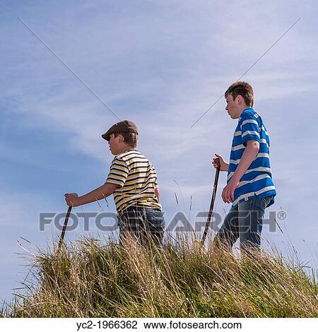 Two boys ( brothers ) age 9 and 13 on a country walk in the Uk. View Large Photo Image Stock Image - Two boys ( brothers ) age 9 and 13 on a country walk in the Uk.. Fotosearch