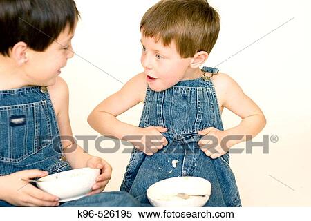 Stock Photography - two boys eating. Fotosearch
