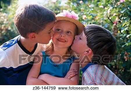 Two boys kissing girl View Large Photo Image Stock Photo - Two boys kissing girl. Fotosearch