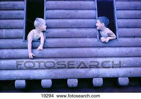 Two boys playing in fort in park View Large Photo Image Picture - Two boys playing in fort in park. Fotosearch