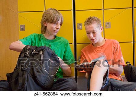 Two boys talking in the hallway View Large Photo Image Picture - Two boys talking in the hallway. Fotosearch