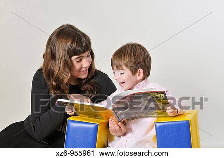 Two brothers Boy and girl reading View Large Photo Image Stock Image - Two brothers Boy and girl reading. Fotosearch