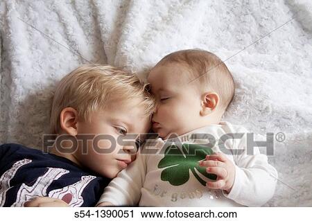 Two brothers, three years old and four months old View Large Photo Image Stock Image - Two brothers, three years old and four months old. Fotosearch