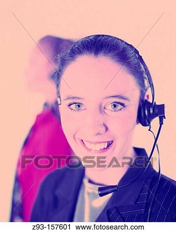 Two business women wearing headsets View Large Photo Image Stock Image - Two business women wearing headsets. Fotosearch