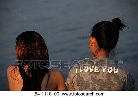 Two Cambodian Girls sitting on the Mekong River View Large Photo Image Stock Image - Two Cambodian Girls sitting on the Mekong River. Fotosearch