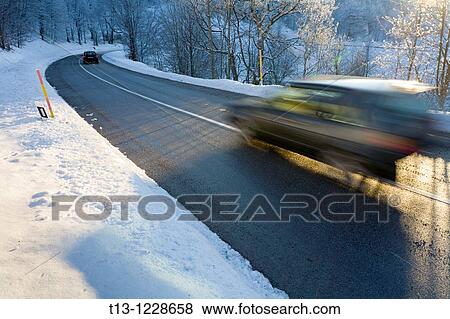 Two cars are passing by, Winter and snow View Large Photo Image Stock Photo - Two cars are passing by, Winter and snow. Fotosearch