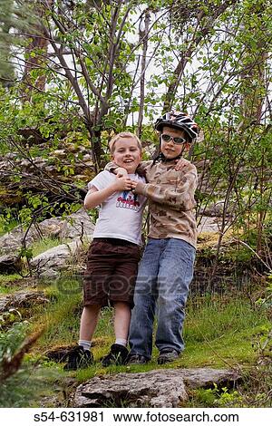 Two caucasian boys, 5-10 years old, outdoors. View Large Photo Image Stock Image - Two caucasian boys, 5-10 years old, outdoors.. Fotosearch