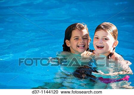 Two caucasian girls in the swimming pool View Large Photo Image Stock Image - Two caucasian girls in the swimming pool. Fotosearch