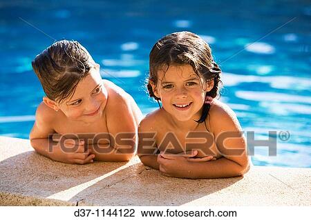 Stock Image - Two caucasian girls in the swimming pool. Fotosearch