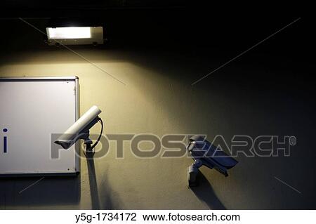 two cctv cameras outside shop front at night View Large Photo Image Stock Image - two cctv cameras outside shop front at night. Fotosearch