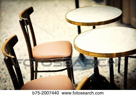Two chairs and two tables vintage, typical of a bar in Paris View Large Photo Image Stock Image - Two chairs and two tables vintage, typical of a bar in Paris. Fotosearch