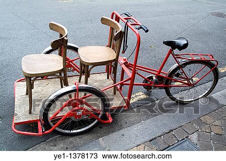 Two chairs on a red rickshaw, Old Bordeaux City, France View Large Photo Image Stock Image - Two chairs on a red rickshaw, Old Bordeaux City, France. Fotosearch