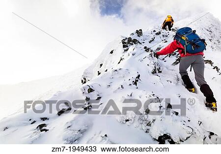 Two climbers ascending Sharp Edge towards the summit of Blencathra. View Large Photo Image Stock Image - Two climbers ascending Sharp Edge towards the summit of Blencathra.. Fotosearch