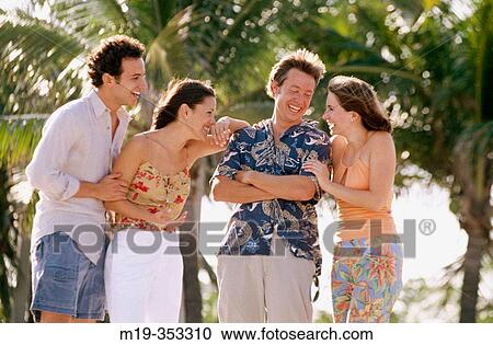 two couples at the beach View Large Photo Image Stock Image - two couples at the beach. Fotosearch