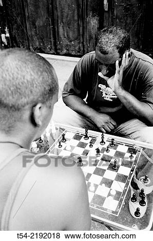 Two Cubans play chess at the roadside View Large Photo Image Stock Photo - Two Cubans play chess at the roadside. Fotosearch