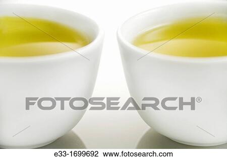 Two cups of green tea View Large Photo Image Stock Image - Two cups of green tea. Fotosearch