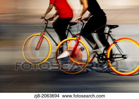 Two cyclists in motion, San Jose, California, USA View Large Photo Image Picture - Two cyclists in motion, San Jose, California, USA. Fotosearch