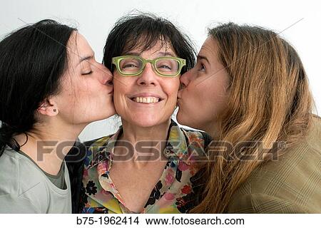 two daughters kissing her mother View Large Photo Image Picture - two daughters kissing her mother. Fotosearch