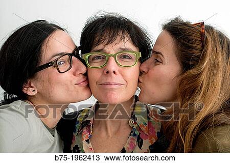 two daughters kissing her mother View Large Photo Image Stock Image - two daughters kissing her mother. Fotosearch