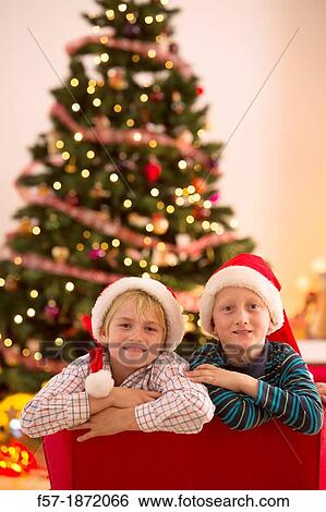 Two eight year old friends at Christmas time View Large Photo Image Stock Photograph - Two eight year old friends at Christmas time. Fotosearch