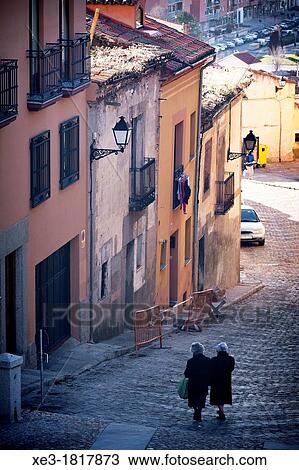 Two elderly women going Downteep street,? vila, Spain. View Large Photo Image Stock Image - Two elderly women going Downteep street,? vila, Spain.. Fotosearch