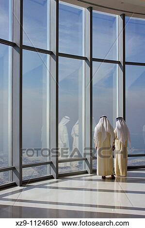 Two Emirati men in the top of the Burj Khalifa, the tallest building on the world, in Dubai UAE View Large Photo Image Stock Image - Two Emirati men in the top of the Burj Khalifa, the tallest building on the world, in Dubai UAE. Fotosearch
