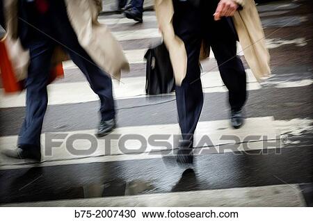 Two executives moving across a pedestrian crossing in Paris, France, Europe View Large Photo Image Stock Image - Two executives moving across a pedestrian crossing in Paris, France, Europe. Fotosearch