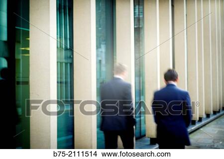 two executives, unrecognizable, walking through the City of London. London, England, UK, Europe. View Large Photo Image Picture - two executives, unrecognizable, walking through the City of London. London, England, UK, Europe.. Fotosearch