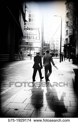 two executives walking around the City of London, England, UK View Large Photo Image Picture - two executives walking around the City of London, England, UK. Fotosearch