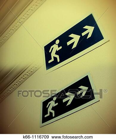 Two exit signs View Large Photo Image Stock Photo - Two exit signs. Fotosearch
