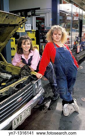 two female mechanics outside their workshop posing for the camera View Large Photo Image Stock Image - two female mechanics outside their workshop posing for the camera. Fotosearch
