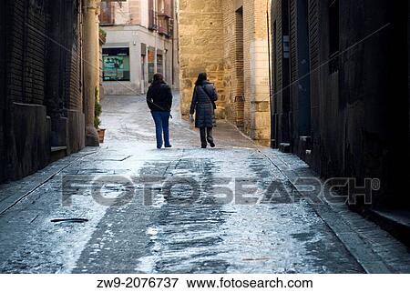 Two female tourist in some medieval street of Toledo, Castilla La Mancha, Spain View Large Photo Image Stock Photo - Two female tourist in some medieval street of Toledo, Castilla La Mancha, Spain. Fotosearch