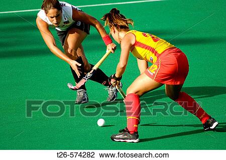 two field hockey female players fighting for the ball View Large Photo Image Stock Image - two field hockey female players fighting for the ball. Fotosearch