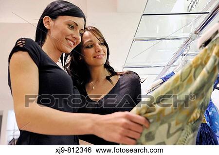 Two friends dressed look in the shop. View Large Photo Image Stock Photograph - Two friends dressed look in the shop.. Fotosearch
