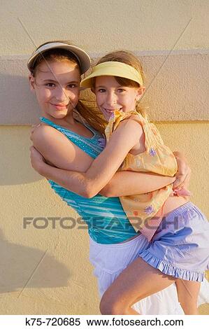 two girlfriends fooling around View Large Photo Image Stock Photography - two girlfriends fooling around. Fotosearch