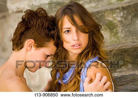 Two girlfriends hug View Large Photo Image Stock Image - Two girlfriends hug. Fotosearch