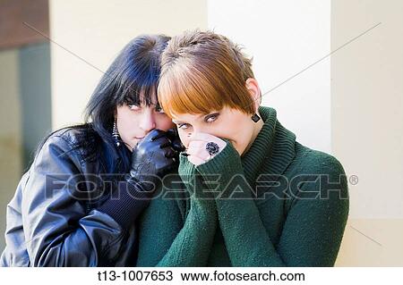 Stock Image - Two girlfriends protective. Fotosearch
