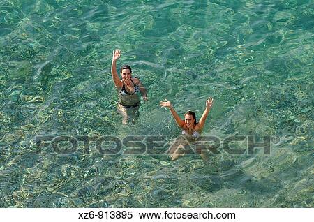 two girls bathing in the sea View Large Photo Image Stock Photography - two girls bathing in the sea. Fotosearch