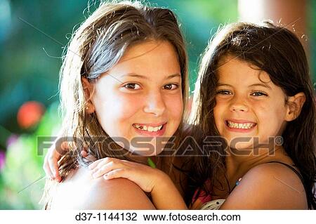 Stock Image - Two girls having fun. Fotosearch