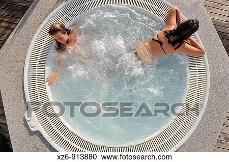 two girls in the Jacuzzi spa from above View Large Photo Image Stock Image - two girls in the Jacuzzi spa from above. Fotosearch