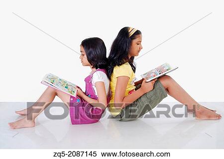 Two girls reading books, Pune, India. View Large Photo Image Stock Photography - Two girls reading books, Pune, India.. Fotosearch