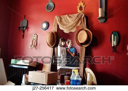Two girls reflected in a mirror View Large Photo Image Stock Photo - Two girls reflected in a mirror. Fotosearch